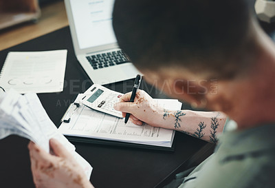 Buy stock photo Shot of an unrecognizable businessman doing paperwork in an office at work