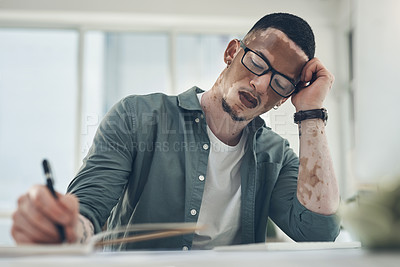 Buy stock photo Shot of a young business man working in a modern office