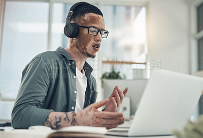 Buy stock photo Shot of a young business busy with a video call at work