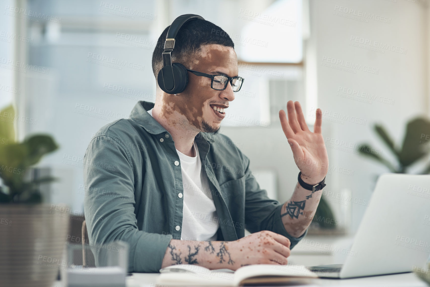 Buy stock photo Shot of a young business busy with a video call at work