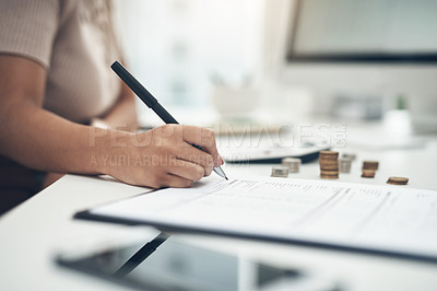 Buy stock photo Closeup shot of an unrecognisable businesswoman calculating finances in an office