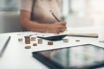 Buy stock photo Closeup shot of an unrecognisable businesswoman calculating finances in an office