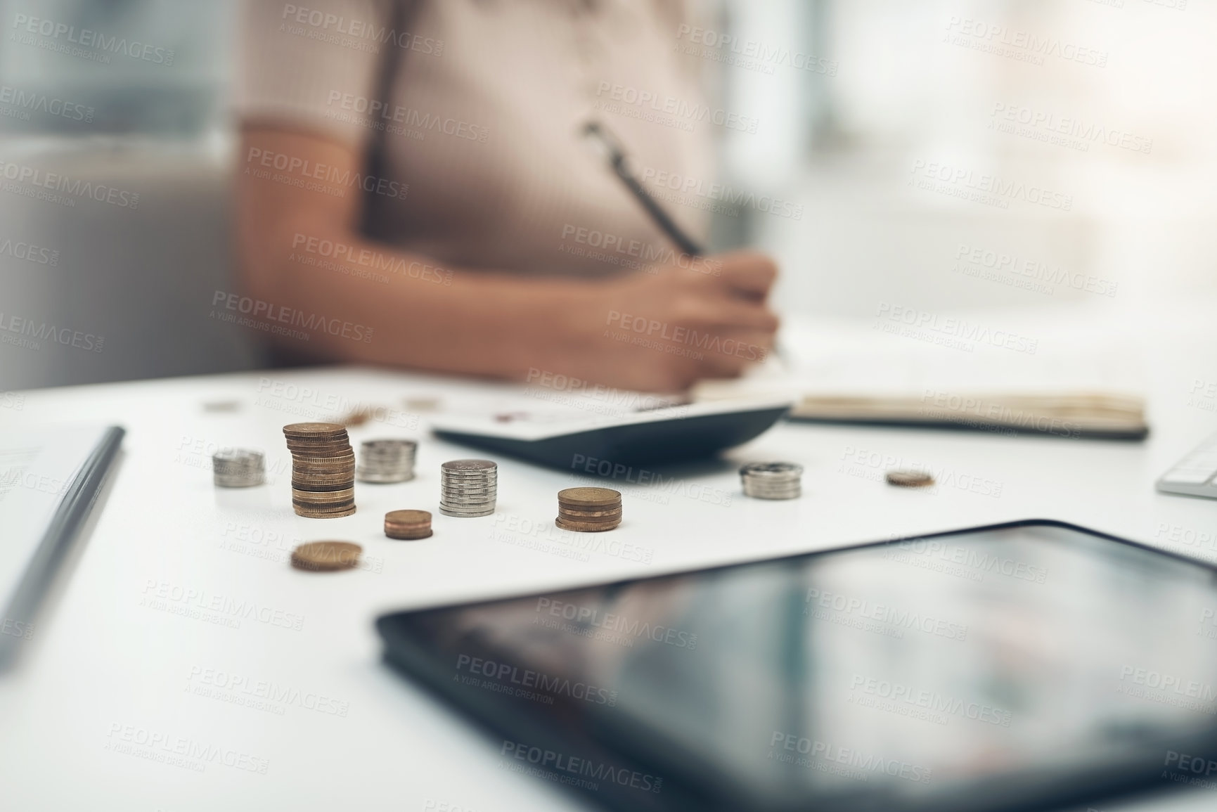 Buy stock photo Closeup shot of an unrecognisable businesswoman calculating finances in an office