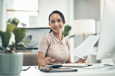 Buy stock photo Portrait of a young businesswoman calculating finances in an office
