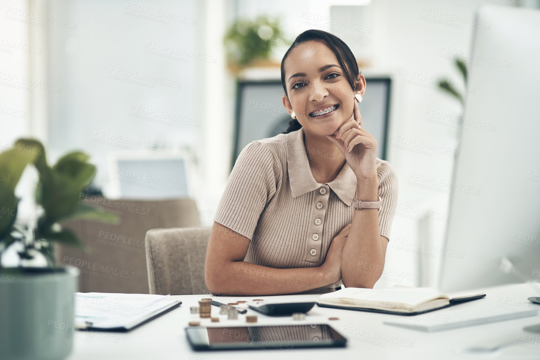 Buy stock photo Relaxed young female financial advisor working as an accounting employee or admin portrait. Female work staff counting money and calculating a budget for a department in a company