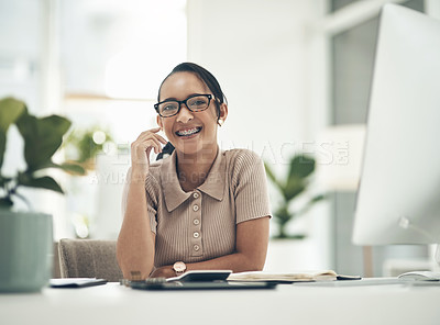 Buy stock photo Portrait of a young businesswoman calculating finances in an office