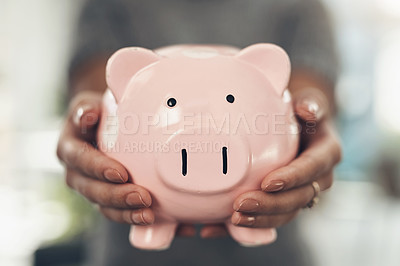 Buy stock photo Closeup shot of an unrecognisable businesswoman holding a piggybank
