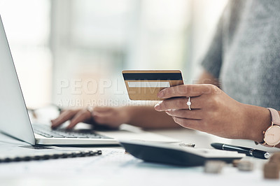 Buy stock photo Banking, payment and paying bills online with ebanking on a laptop with a credit or debit card. Closeup of a woman doing online shopping during inflation. Female making payment for debt and mortgage.