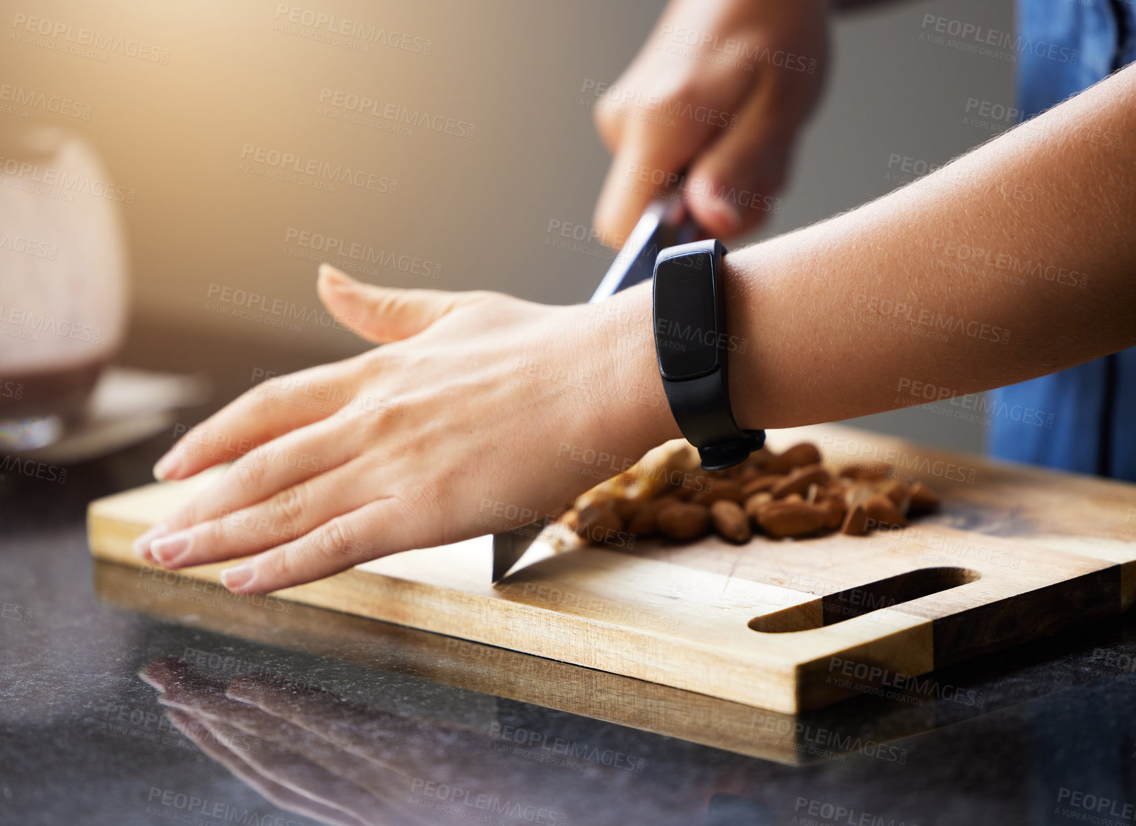 Buy stock photo Shot of an unrecognisable woman preparing a healthy meal at home