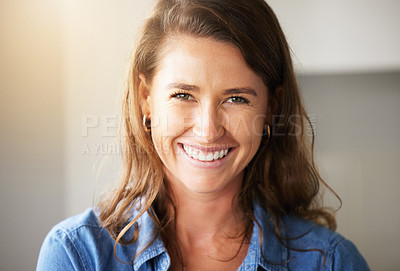 Buy stock photo Shot of a young woman standing in the kitchen at home