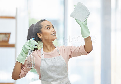 Buy stock photo Woman, cleaning and smile for window, glass and hygiene of house, safety and cloth with spray for cleaner. Home, washing and apron for housework, bottle and glove to tidy, happy and water with soap