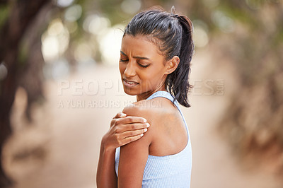 Buy stock photo Fitness, running and woman with shoulder pain after outdoor training for a race or marathon. Sports, health and female athlete with a bruise or sprain arm muscle after a cardio workout in nature.