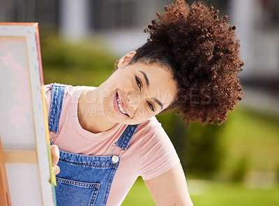 Buy stock photo Cropped portrait of an attractive young woman painting in the park