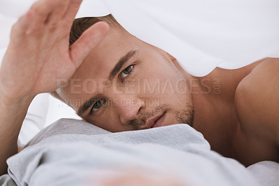 Buy stock photo morning, portrait or man with blanket, cover or pillow in bedroom for resting in home, house or apartment. Wake up, relax and guy sleeping on break with peace, bedding or wellness on weekend chill