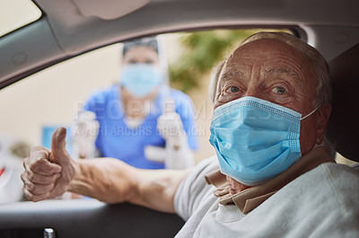 Buy stock photo Shot of a senior man and a young healthcare worker showing a thumbs up at a drive through vaccination site