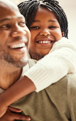 Buy stock photo Shot of a young father giving his daughter a piggyback at home