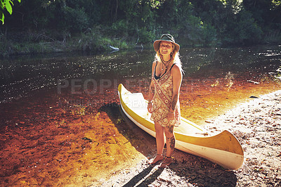 Buy stock photo Shot of a young woman out by the lake with a kayak