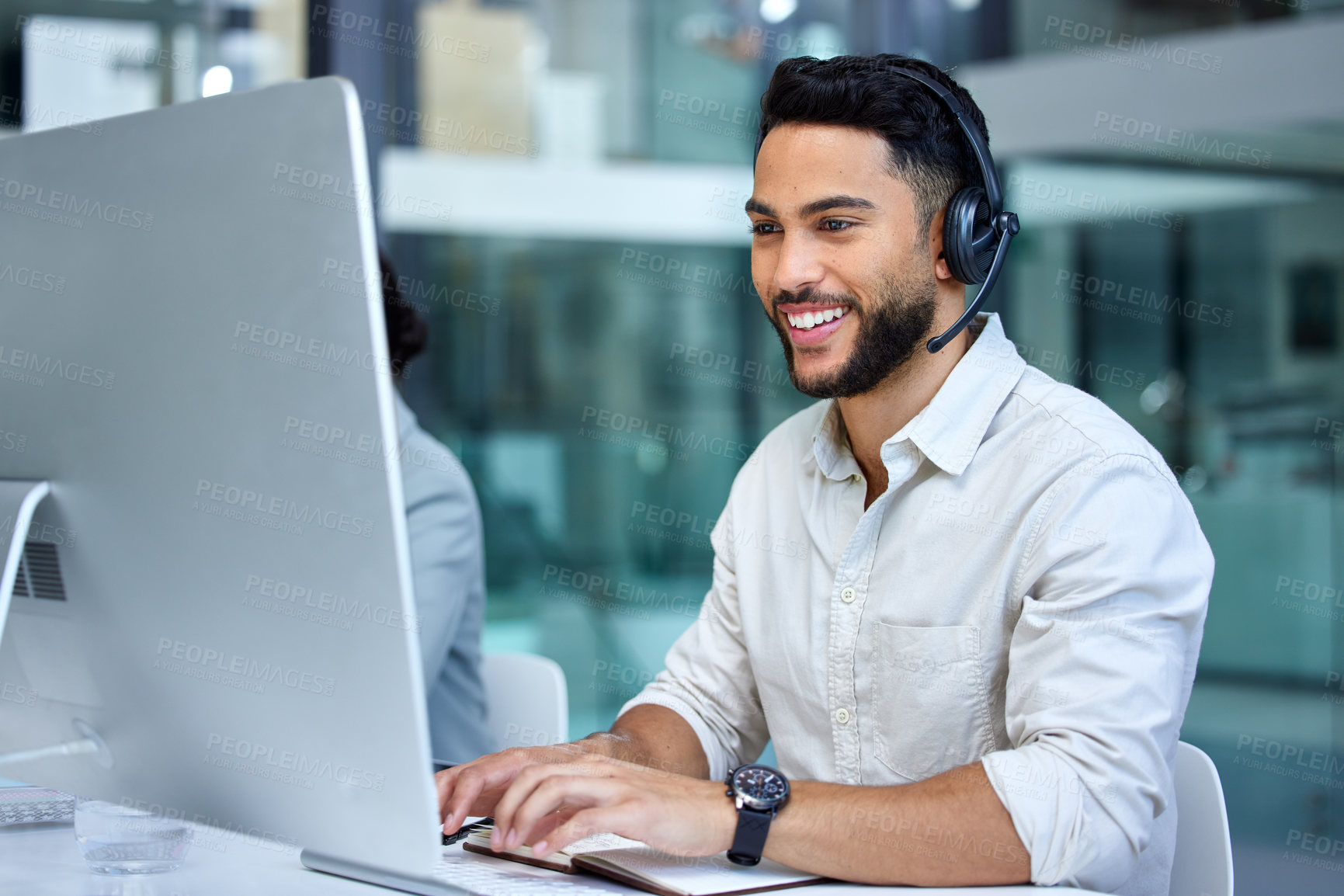 Buy stock photo Business man, call center and web support communication at a computer in a office. Phone conversation, smile and male worker with contact us, crm and customer service job in a consulting agency