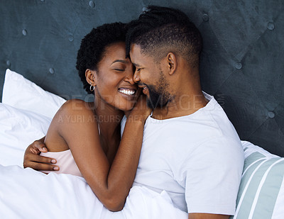 Buy stock photo Black couple and embrace or hug in bed with smile for love, romantic and care on Saturday morning. Relaxing, dating and relationship with passion for partner with comfort, waking up and rest in home