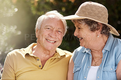Buy stock photo Portrait of an elderly couple enjoying the sun in their backyard
