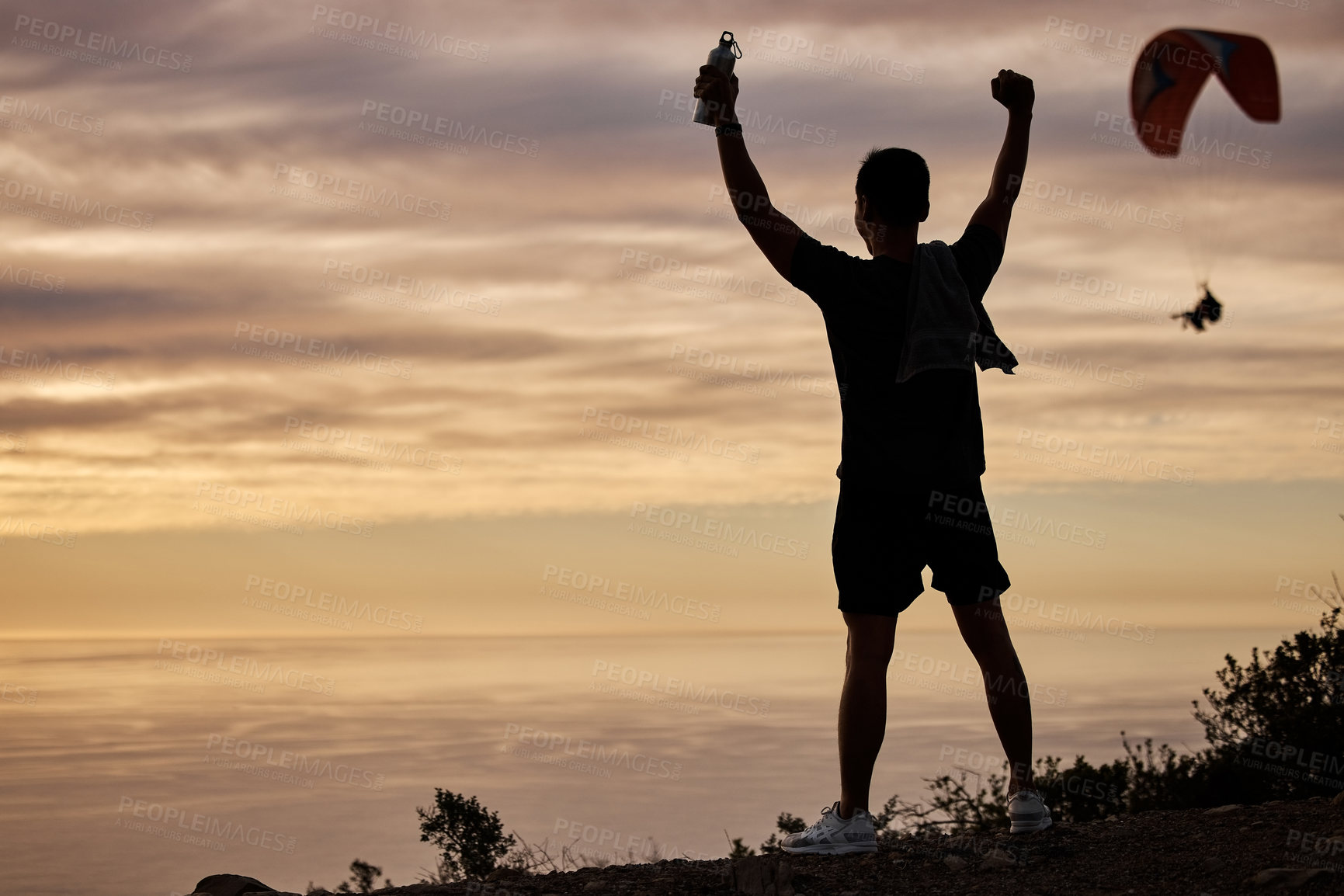 Buy stock photo Shot of a young man exercising in nature