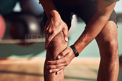Buy stock photo Sports, fitness and man with knee pain in gym with injury after exercise, training and workout. Medical emergency, accident and hands of male person on leg for muscle strain, joint ache and hurt