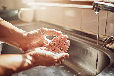 Buy stock photo Soap, water and cleaning hands in kitchen for hygiene, health and wellness in home to clean skin. Tap, sink and skincare, hand wash with cleansing foam and bubbles for germ and bacteria protection.