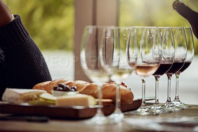 Buy stock photo Wine tasting, cheese platter and winery restaurant with alcohol and glass for customer. Waiter, drink and sommelier with bottle for wines and food pairing in a fine dining and luxury experience