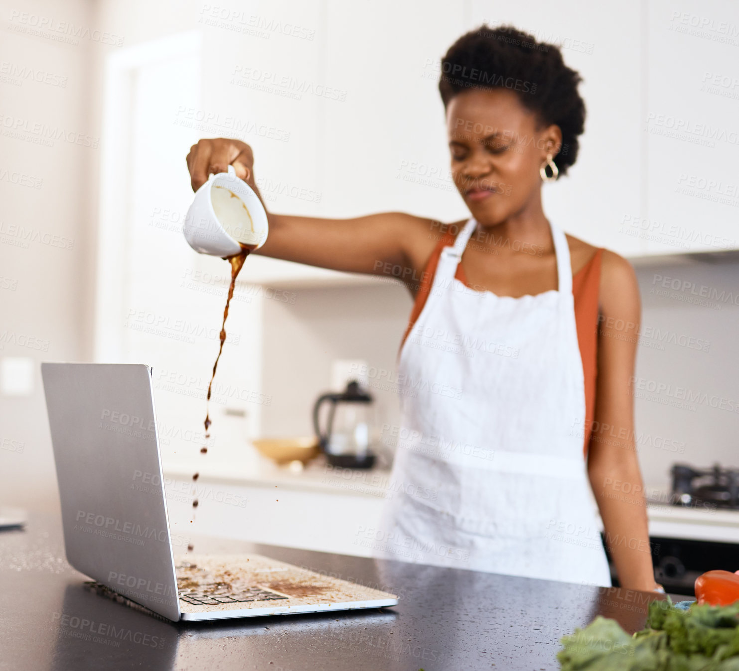 Buy stock photo Shot of a young woman poring coffee on a laptop