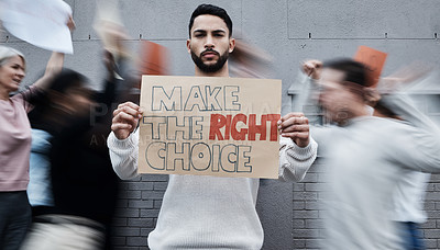 Buy stock photo Shot of a young man holding a placard at a covid vaccine protest