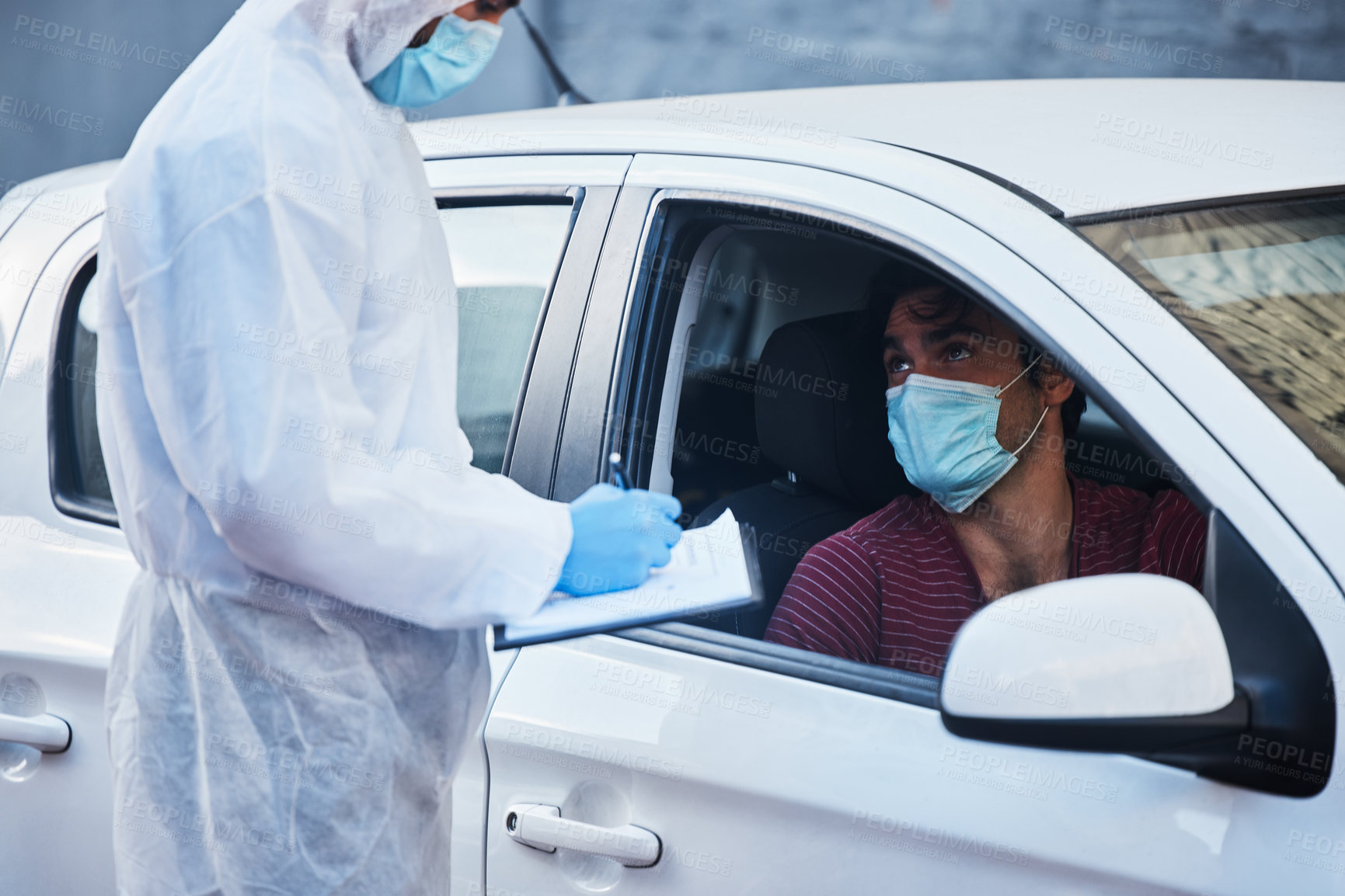 Buy stock photo Car, man and drive through for checklist with doctor for inspection, face mask and questions for disease screening. Male person, health worker and protective suit with clipboard for contact tracing.