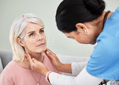 Buy stock photo Shot of a female nurse examining a woman's throat during a consultation