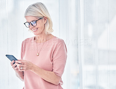 Buy stock photo Home, smile and senior woman with a smartphone, typing and connection for social media, website information and communication. Happy, mature female person and old lady with a cellphone and mobile app