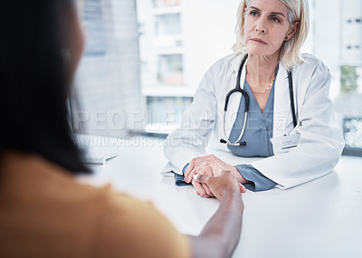 Buy stock photo Consulting, support and holding hands of doctor and patient for medical, empathy and advice. Medicine, healthcare and help with women in hospital exam room for depression, compassion and hope