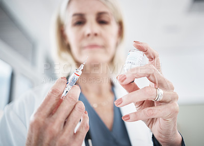 Buy stock photo Shot of a doctor getting ready to administer an injection to her patient