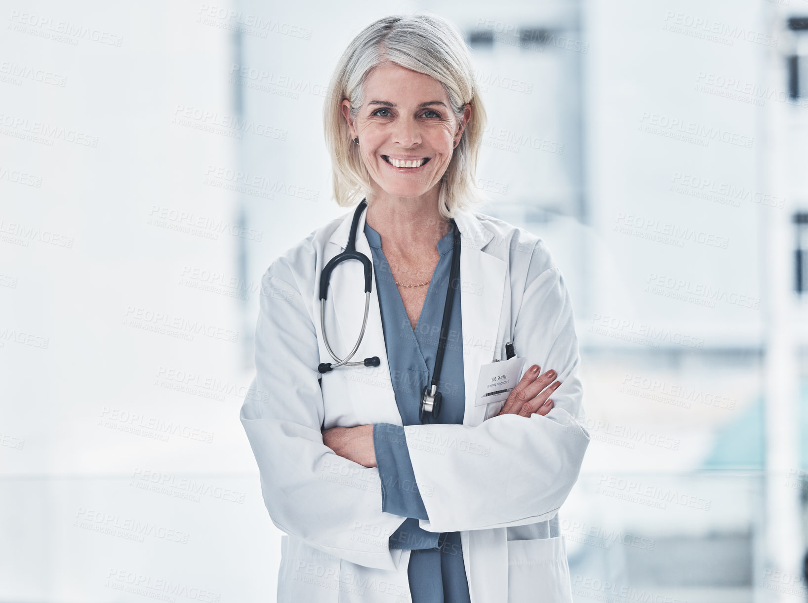 Buy stock photo Mature, woman and doctor arms crossed in portrait for career in medicine, healthcare and professional as general practitioner. Female medical worker, happiness and confident with pride in hospital. 