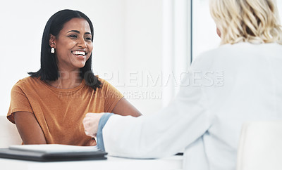 Buy stock photo Shot of a doctor having a consultation with a young woman