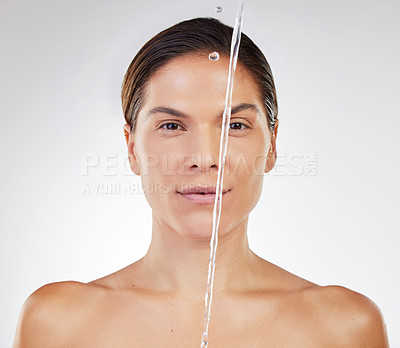 Buy stock photo Shot of a young woman getting ready to wash her face against a studio background