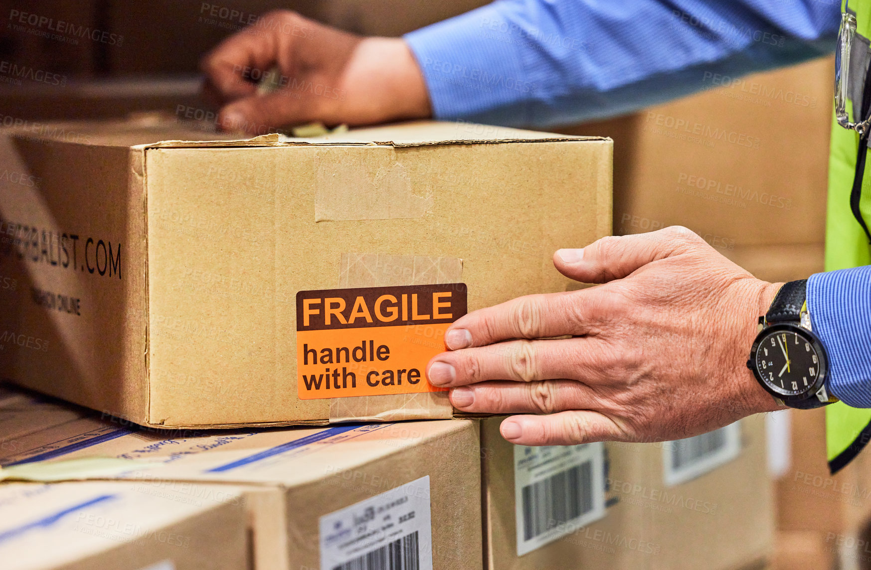 Buy stock photo Shot of a unrecognizable man packing boxes in a warehouse