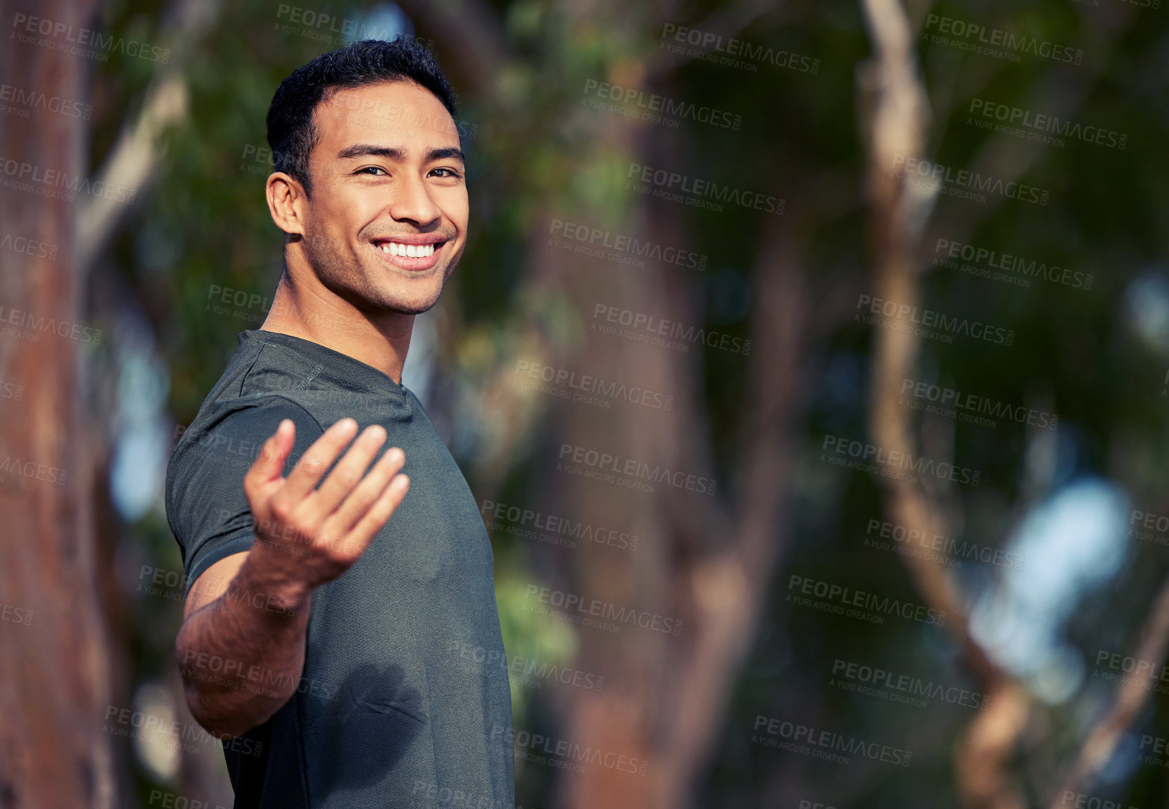 Buy stock photo Fitness, portrait of a man and outdoors in nature forest with hand gesture to follow him. Exercise or training, motivation or happiness and workout male athlete outside in trees for health wellness