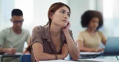 Buy stock photo Education, depression and girl university student in a classroom bored, adhd or daydreaming during lecture. Thinking, anxiety and female learner distracted in class, contemplation, boredom or sad