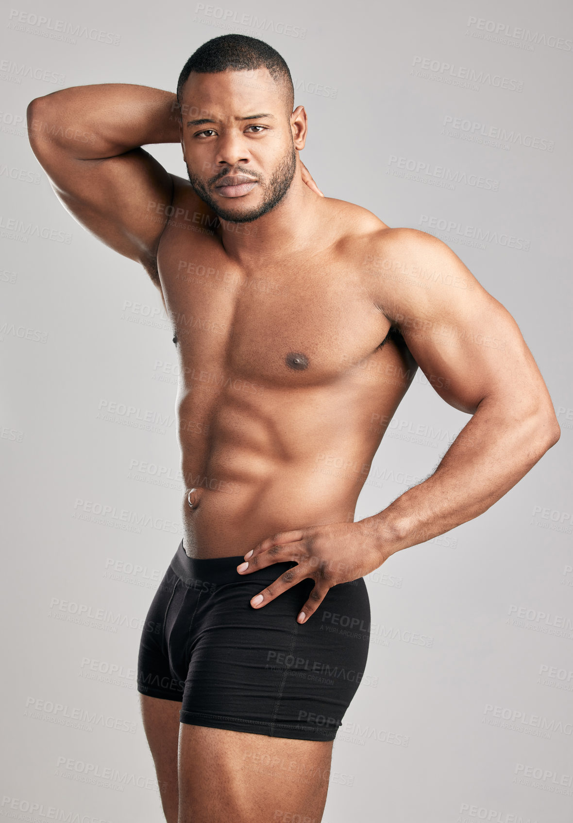 Buy stock photo Muscle, portrait and black man in studio with underwear for fitness or health with confidence for flexing. Wellness, strength and bodybuilding competition in America with pride for body with training