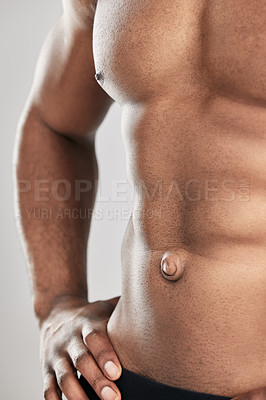 Buy stock photo Studio shot of a unrecognizable muscular man posing against a grey background