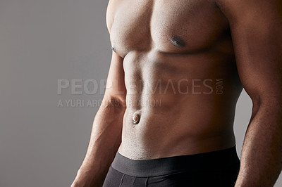 Buy stock photo Studio shot of a unrecognizable muscular man posing against a grey background