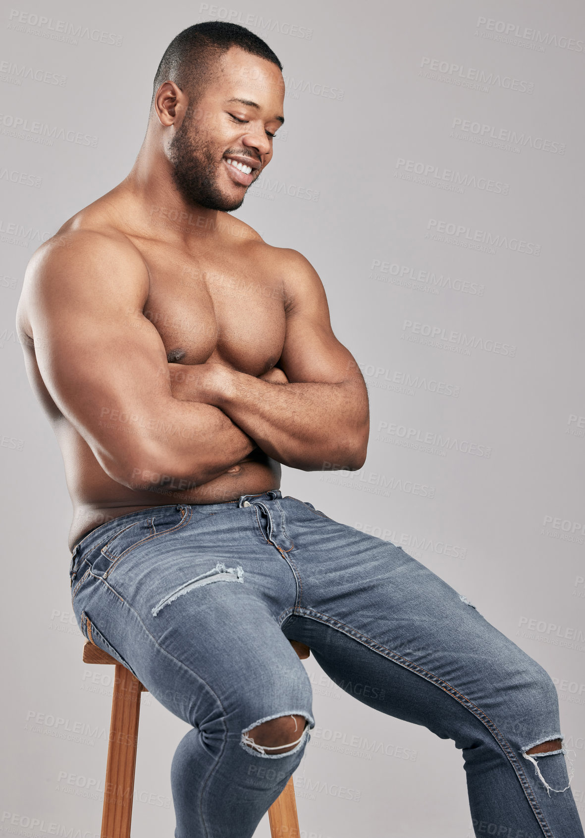 Buy stock photo Studio, jeans and muscle of black man, strong and gym for fitness with smile, wellness and fashion. White background, healthy and pants of person, bodybuilder and workout for athlete and body