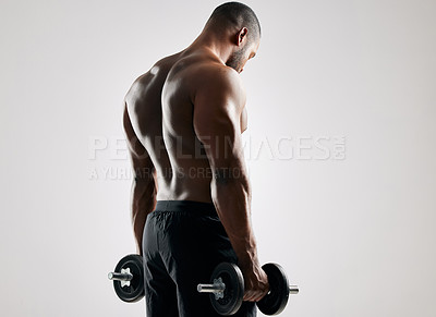 Buy stock photo Man, studio and workout with weights to exercise for healthy living or fitness and committed on white background. Gym equipment, back and dumbbells for muscle or training with wellbeing and self care