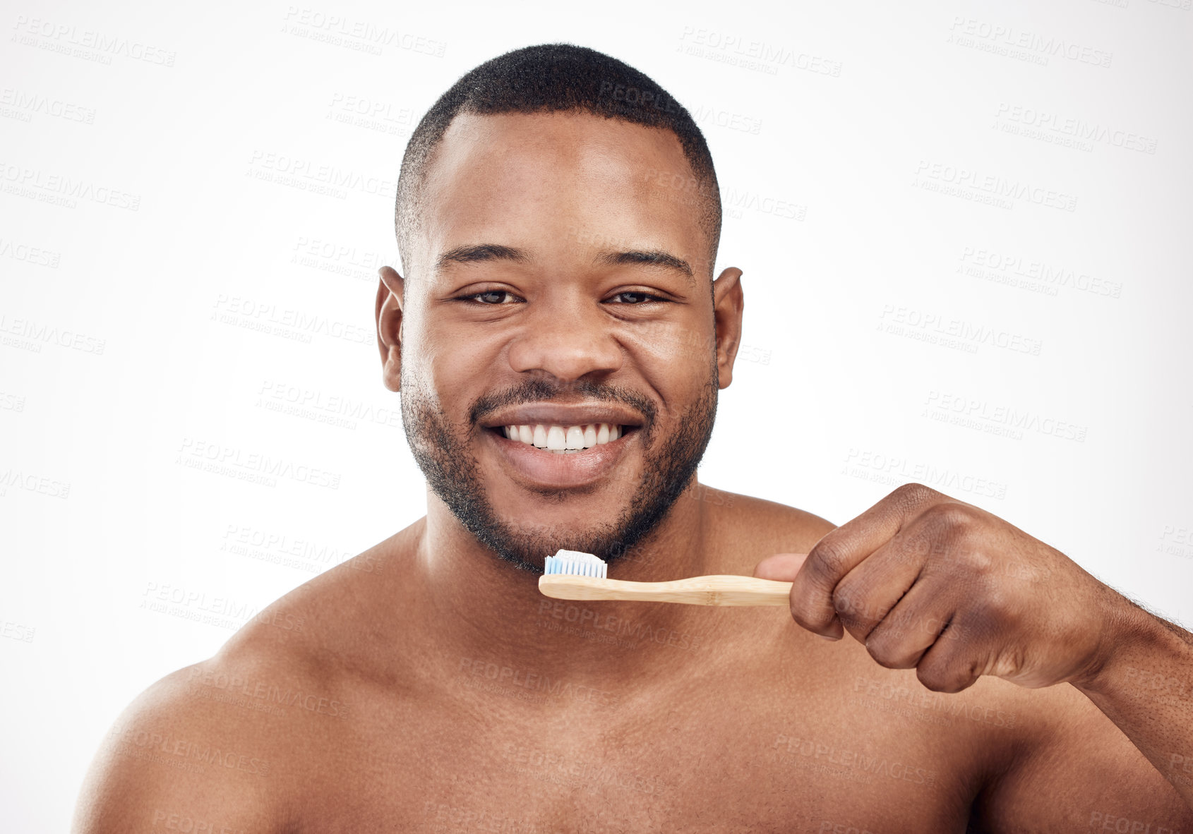 Buy stock photo Black man, portrait and brushing teeth or smile cleaning in studio for healthy gums, hygiene or white background. Male person, face and toothbrush for whitening routine or care, results or mockup