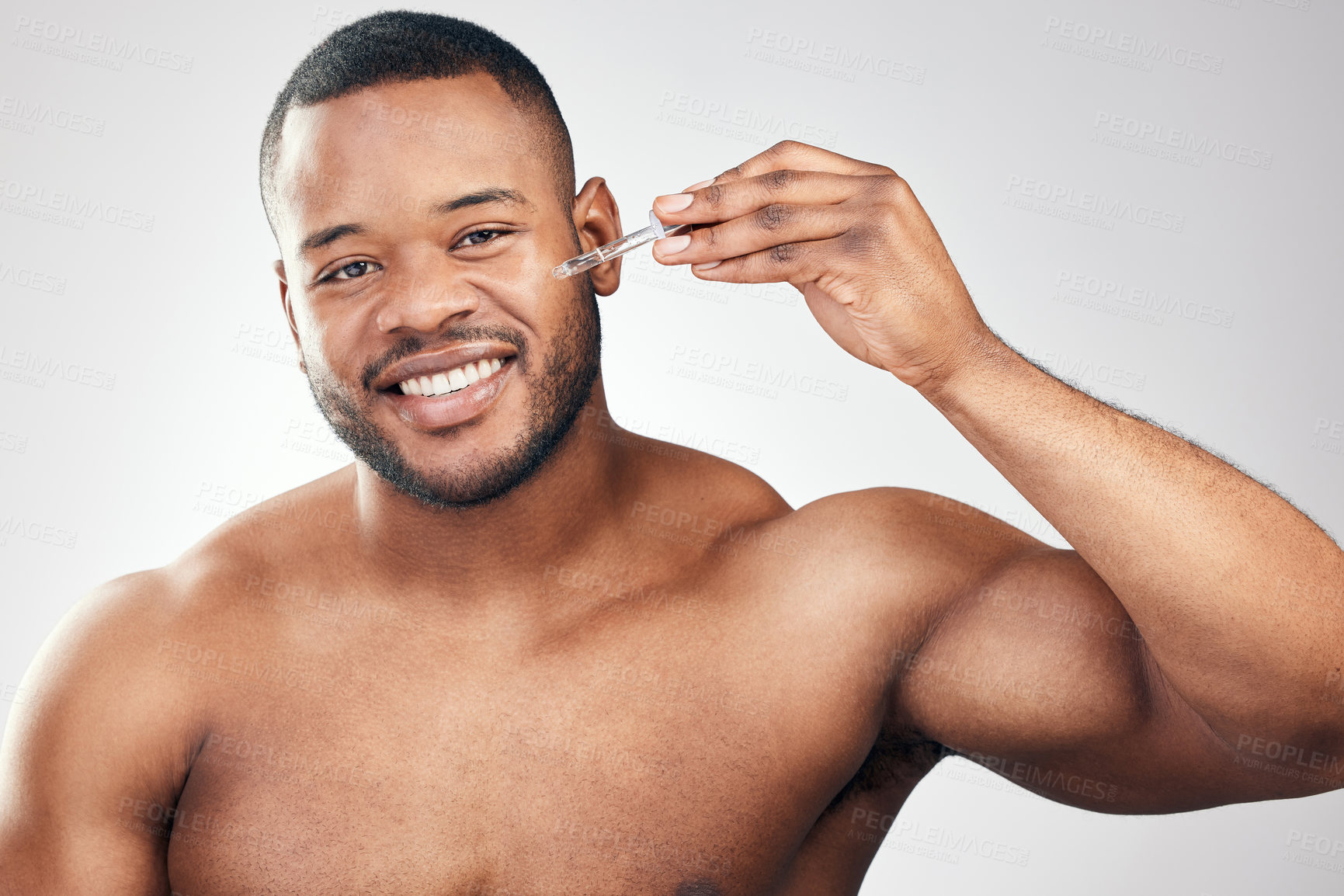 Buy stock photo Black man, skincare and portrait in studio with serum for grooming, luxury and morning routine on white background. Dermatology, topless model and treating skin for wellness, results and cosmetics