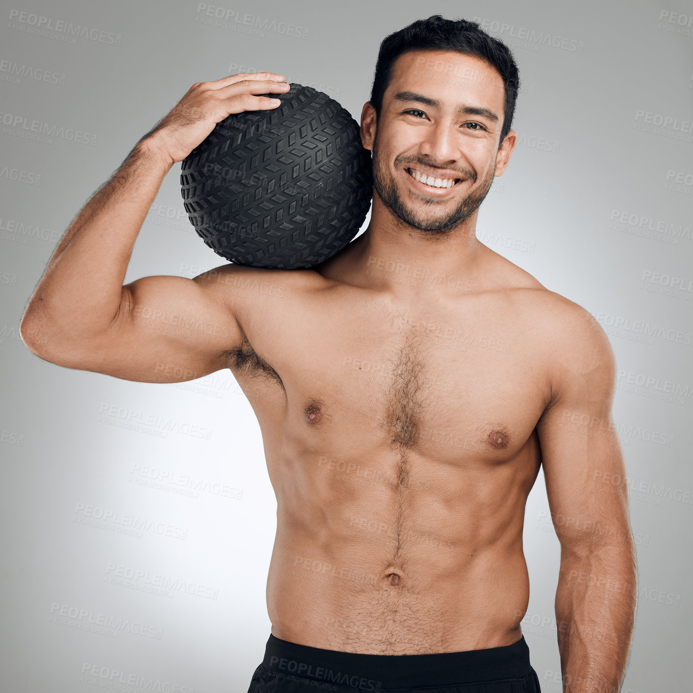 Buy stock photo Fitness, medicine ball and portrait of shirtless man in studio on gray background for health or hydration. Body, exercise and smile with happy or strong sports person at gym for training or workout