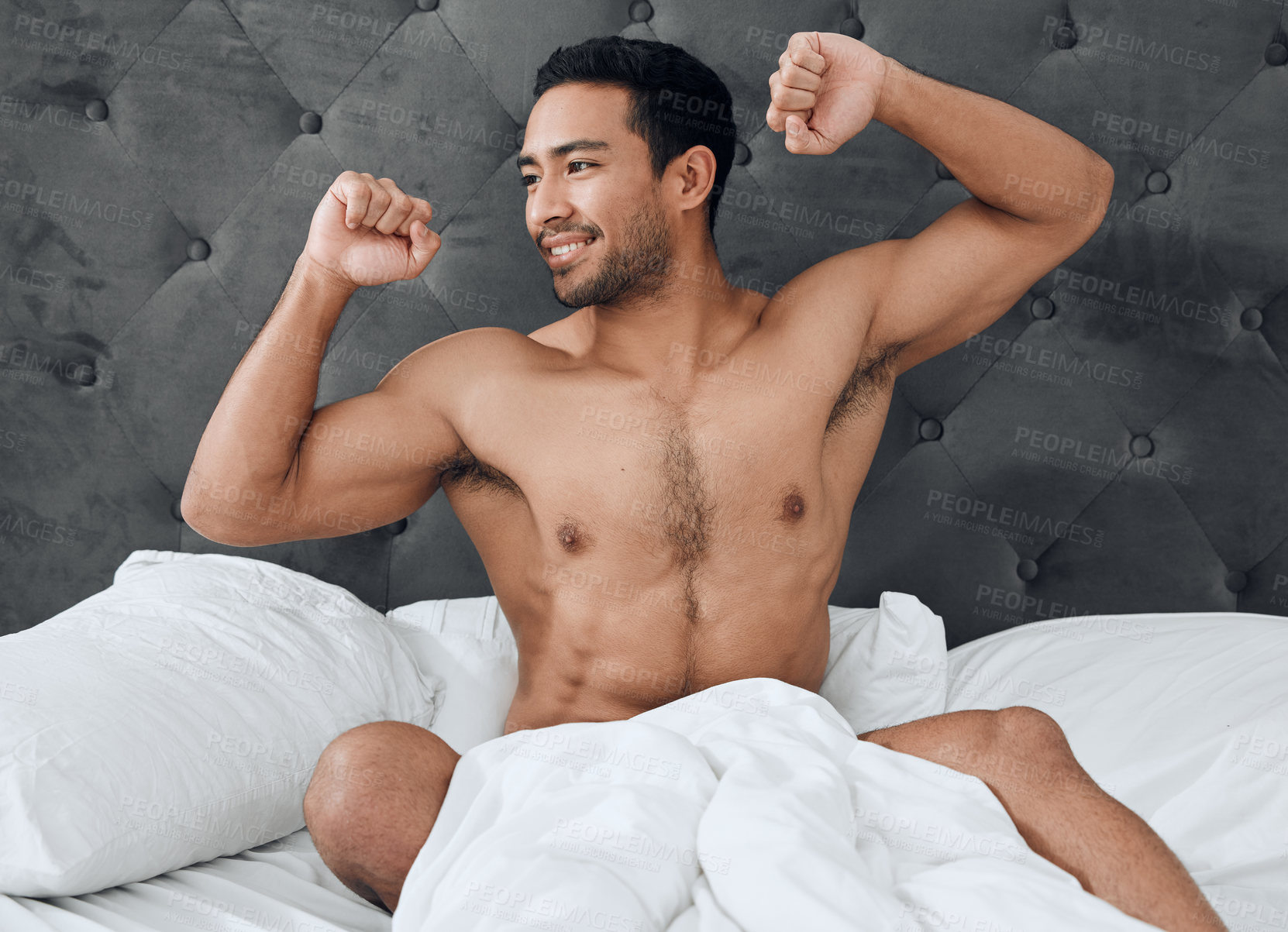 Buy stock photo Body, man and stretching in bedroom with pride, smile and wellness on weekend in home. Asian male person, abs and topless with happiness, confidence and relax in morning for wakeup in apartment 